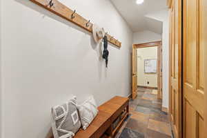 Mudroom featuring stone tile flooring and recessed lighting