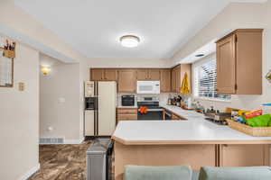 Kitchen with newly finished cabinets and new lighting