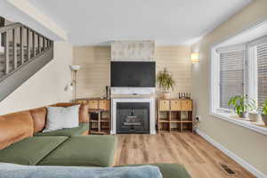 Family room with new LVP floors and fireplace