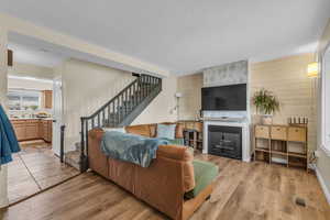 Family room with new LVP floors and fireplace