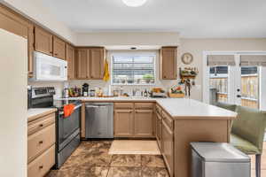 Kitchen with newly finished cabinets and new lighting