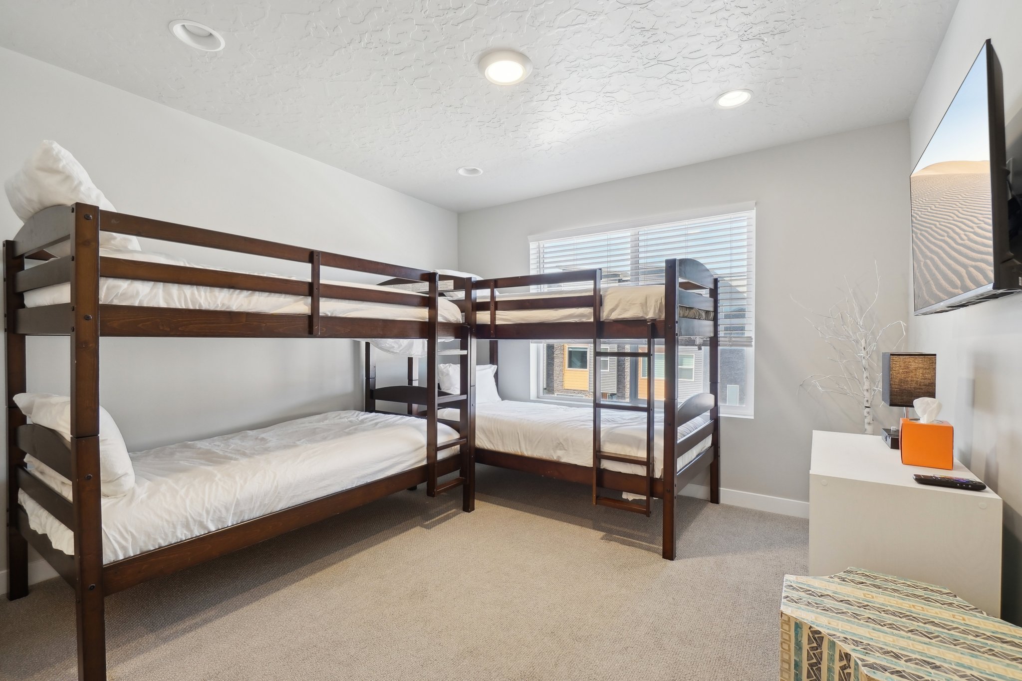Bedroom with light colored carpet, recessed lighting, and a textured ceiling