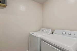 Laundry room featuring washing machine and clothes dryer