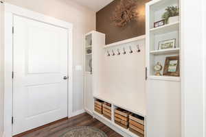 Mudroom with dark wood-style floors