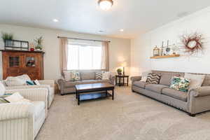 Living room featuring carpet floors and recessed lighting