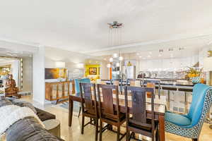 Dining area featuring crown molding and recessed lighting