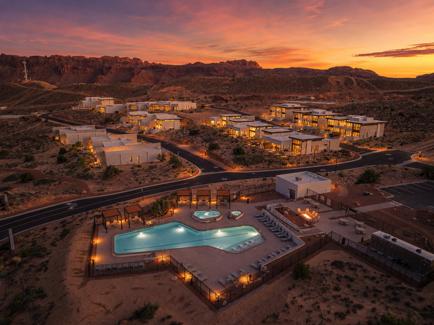 Community amenities featuring a resort-style swimming pool, two hot tubs, and an outdoor fire pit area