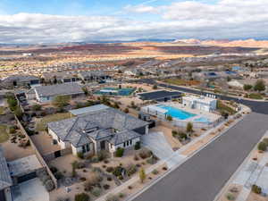 Aerial perspective of suburban area featuring mountains and a pool area