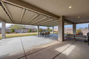 Fenced backyard with a patio area and a pergola