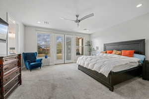 Bedroom with access to exterior, light carpet, a ceiling fan, and recessed lighting