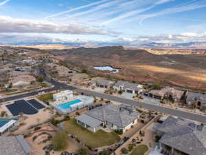Aerial overview of property's location with mountains and nearby suburban area