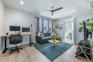 Office area featuring cooling unit, a ceiling fan, light wood-type flooring, and recessed lighting