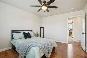 Bedroom with hardwood / wood-style flooring and a ceiling fan