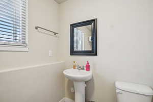 Half bathroom featuring toilet