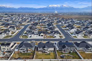 Aerial perspective of suburban area featuring a mountain backdrop