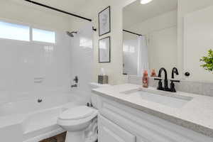 Full bathroom with vanity and shower / bathtub combination with curtain