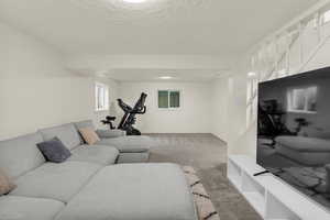 Carpeted living room featuring a textured ceiling