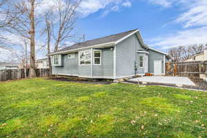 Back of house featuring a fenced backyard and a patio