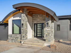 Property entrance with stone siding