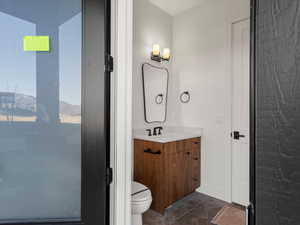 Bathroom with vanity and toilet