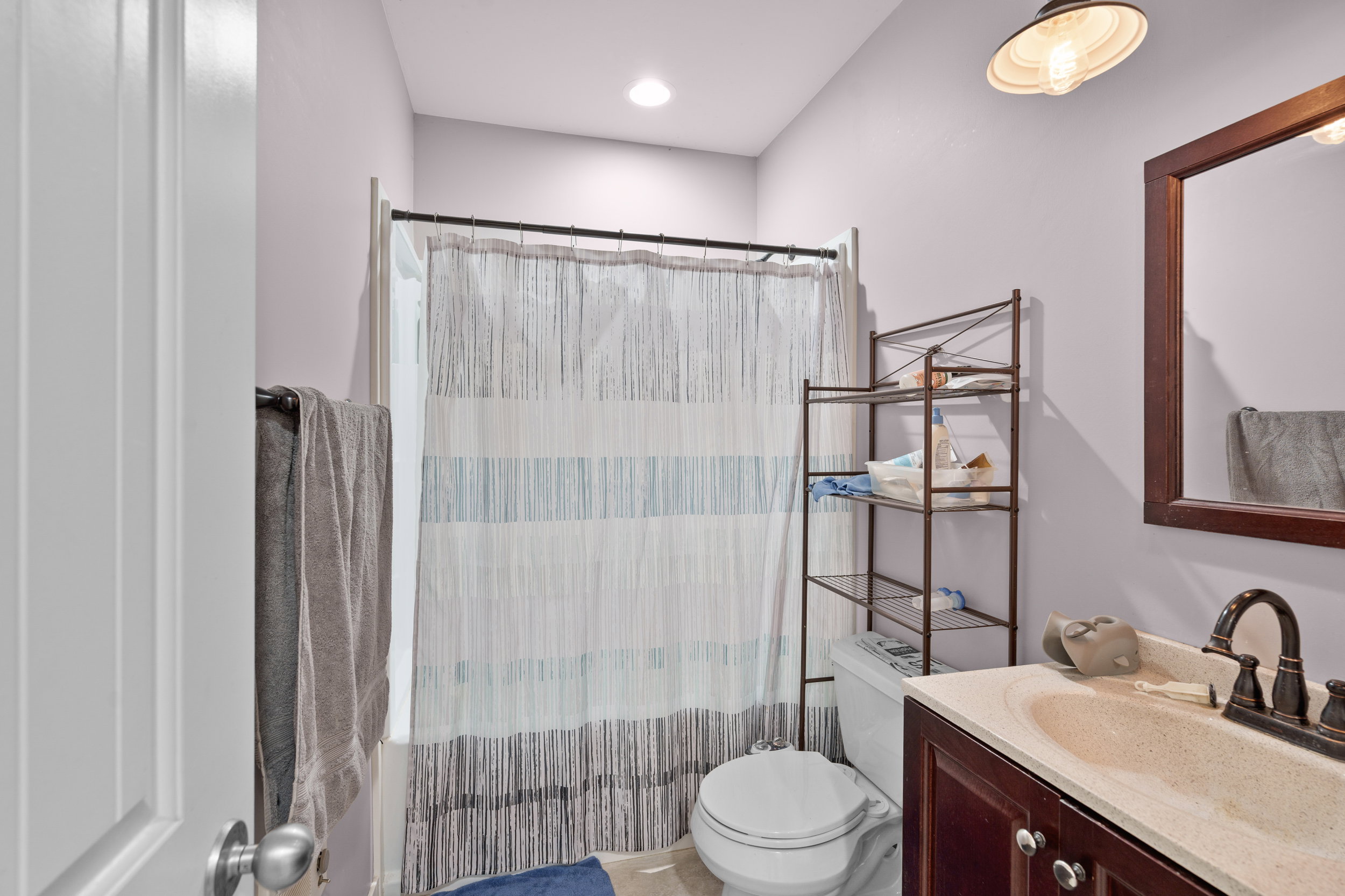 Full bathroom featuring vanity and toilet