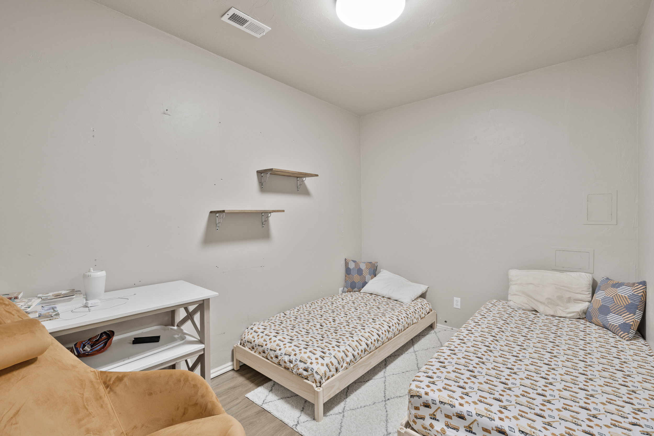 2nd Bedroom featuring wood finished floors and baseboards
