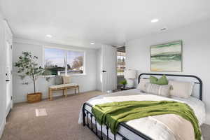 Carpeted bedroom featuring baseboards and recessed lighting