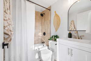 Full bath with vanity and shower / bathtub combination with curtain