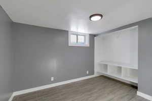 Mudroom with baseboards and wood tiled floors