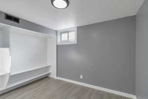 Below grade area with wood finish floors and baseboards