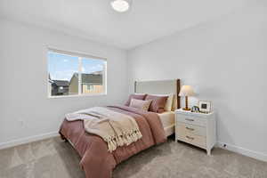 Bedroom with light carpet