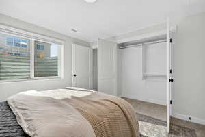 Bedroom featuring a closet and carpet flooring
