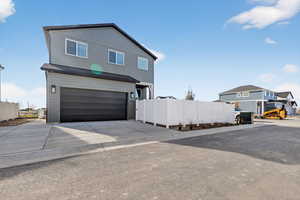 View of front of home featuring a garage and driveway
