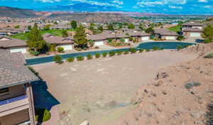 Aerial view of residential area featuring a mountainous background