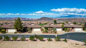 View of mountain backdrop featuring nearby suburban area