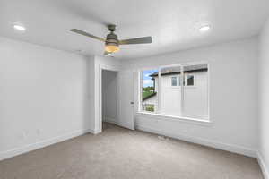 Unfurnished bedroom with carpet floors, a ceiling fan, and recessed lighting