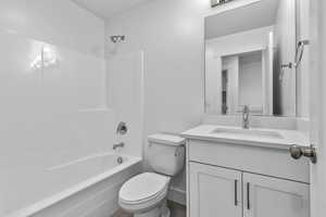 Bathroom featuring vanity and shower / bath combination