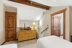 Bedroom with light carpet and baseboards