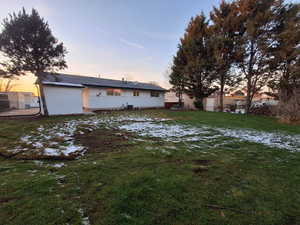 View of back of house at dusk