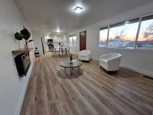 Sitting room with light wood-style flooring and baseboards