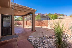 Fenced backyard with a patio area