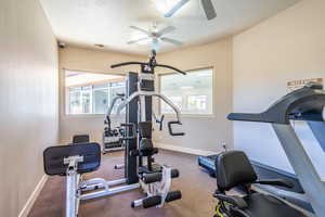 Workout room featuring a ceiling fan