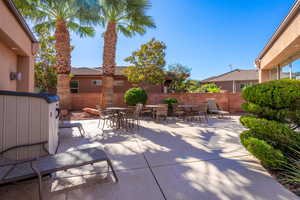 Fenced backyard with a patio and outdoor dining space