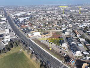 Aerial view of property's location with nearby urban area