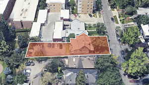 Aerial view of property and surrounding area featuring property parcel outlined