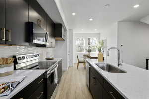 Gourmet kitchen with quartz countertops and soft-close cabinetry.