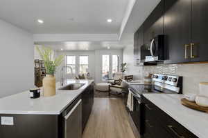 A total 'wow' kitchen-quartz countertops, stainless appliances, and a big island for charcuterie or homework.