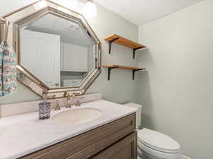 Bathroom with toilet and vanity