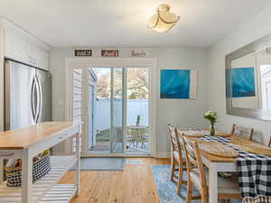 Dining room featuring light wood-style floors and baseboards