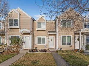 Traditional-style house featuring a front yard